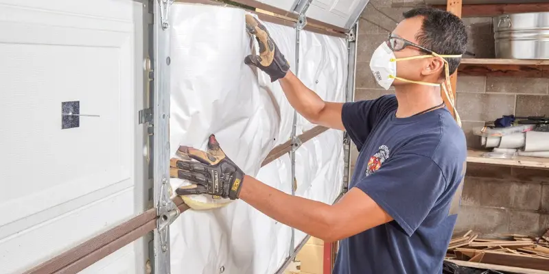 a worker who insulates garage doors