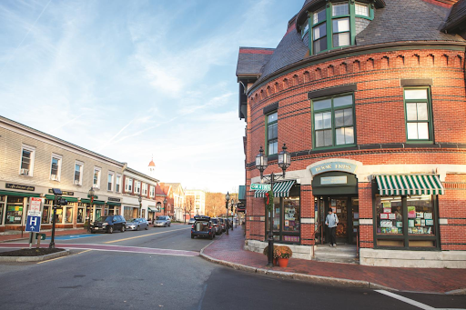 a scenic street view in Winchester, MA, highlighting the charming architecture and local businesses in the area